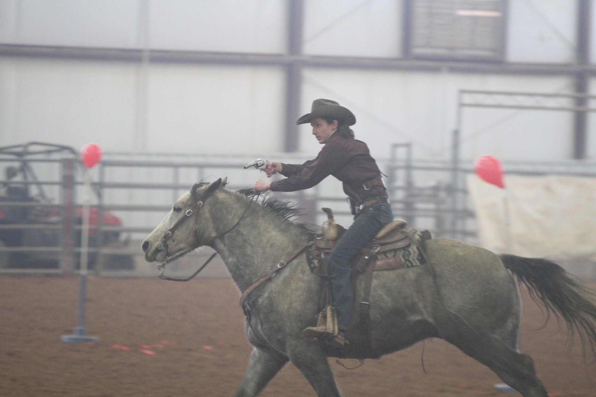 Indoor arena eventing or western competition at the facility.