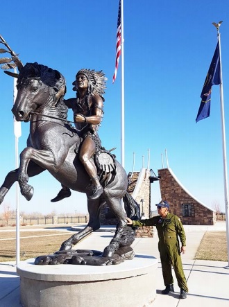 Ute tribe story teller and Viet Nam veteran Larry Cesspooch at the warrior statue at the BoƩ le Hollow Veteran’s Memorial on the Ute ReservaƟ on in Fort Duchesne, Utah. Cesspooch draws on his own war experience to comment on the long ago war story of Chief Sanpitch in the Discovery Road show “The Lost Tomahawk.”